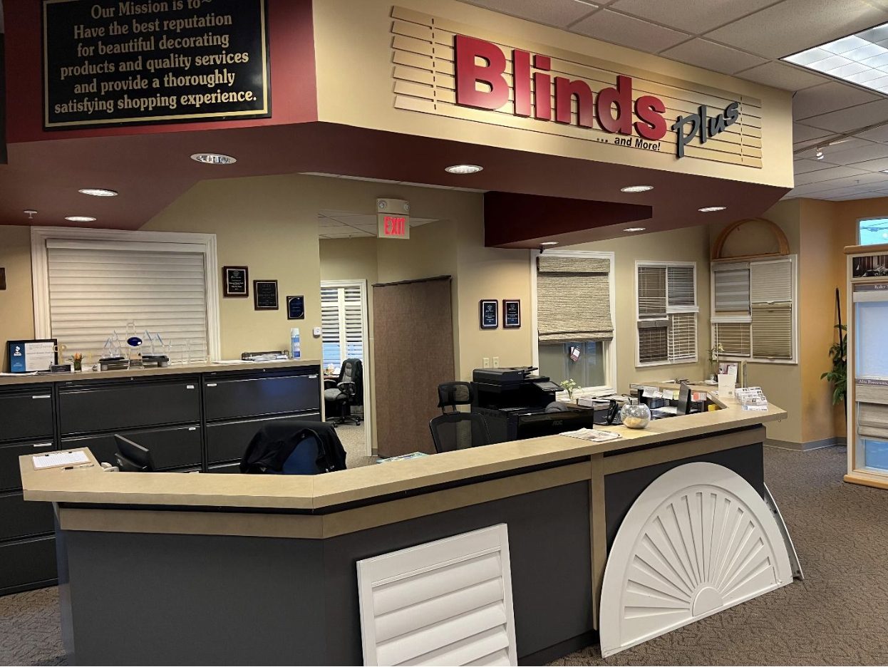 Blinds Plus showroom interior with reception desk and window treatment displays
