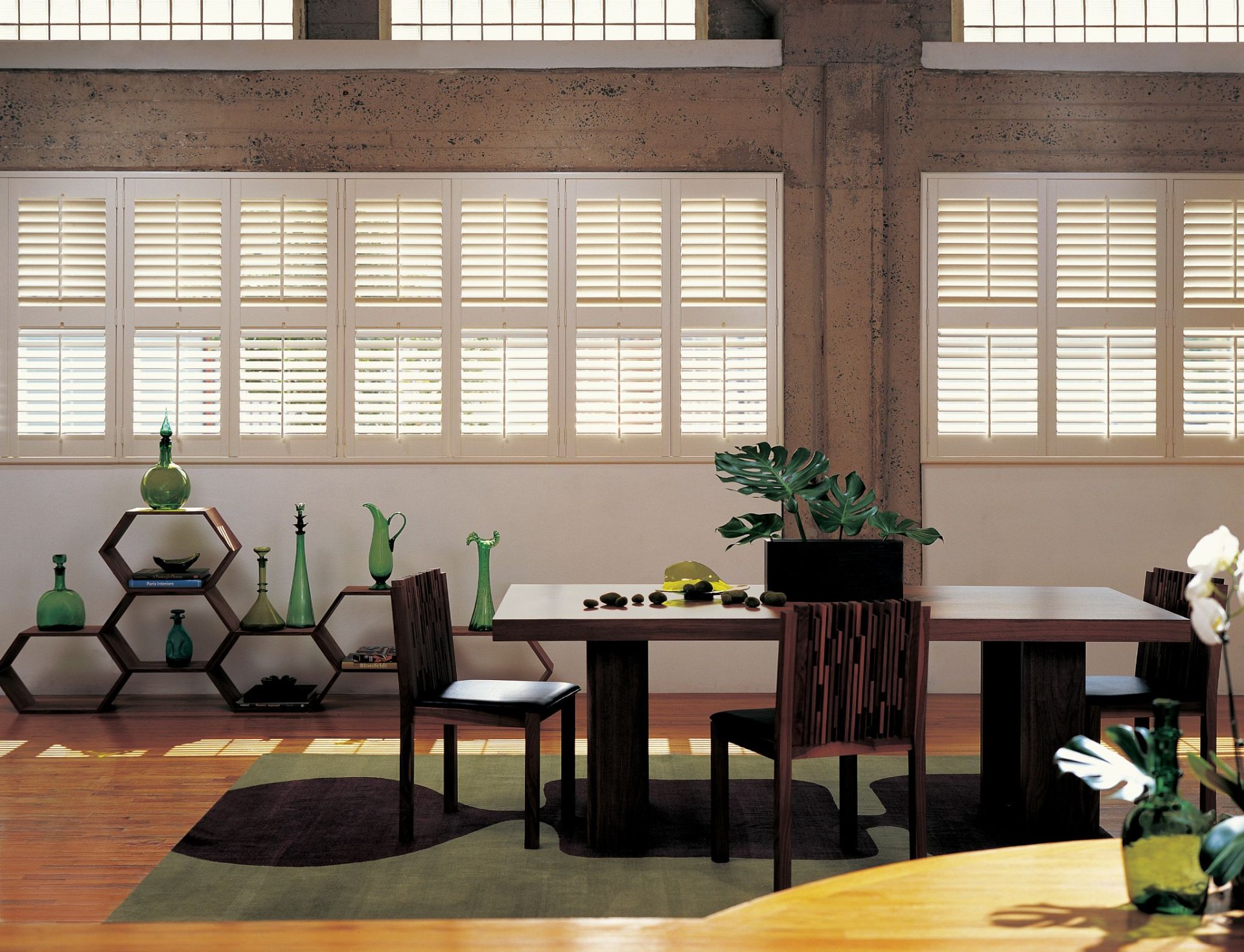 White composite shutters in dining room