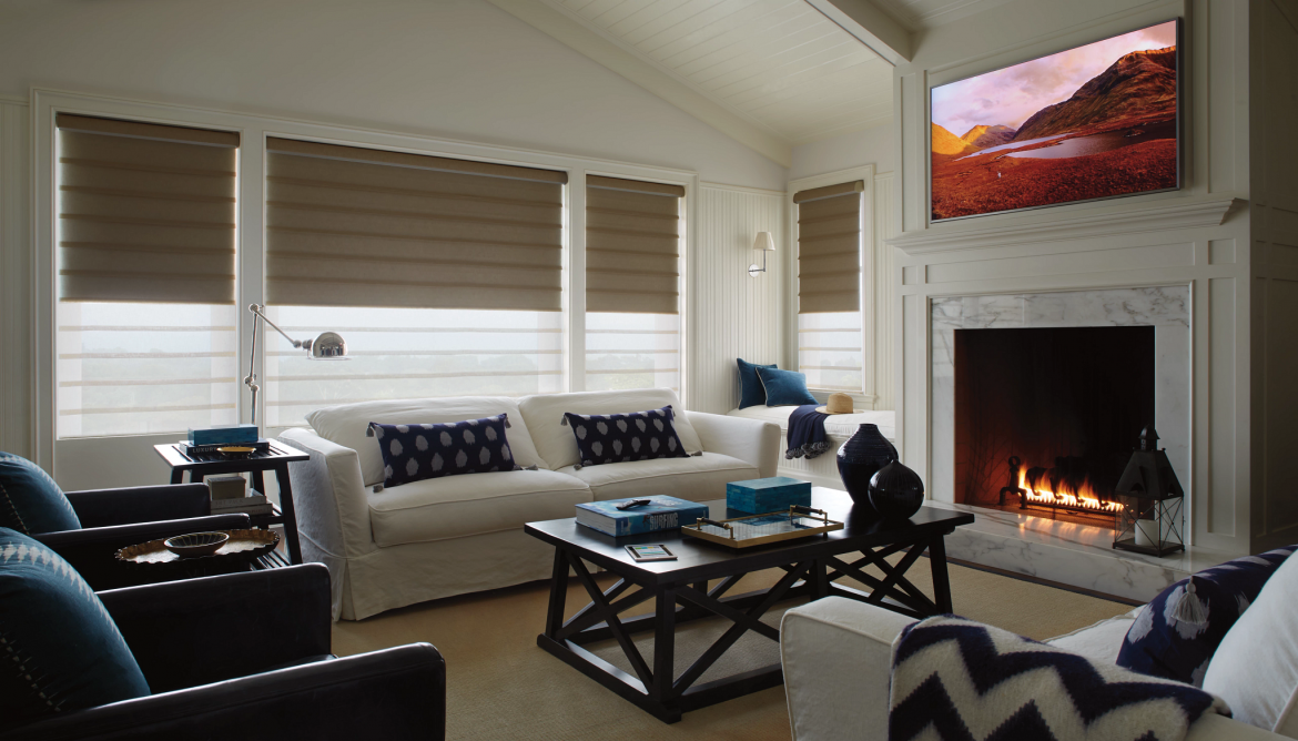 A living room with a fireplace and a couch