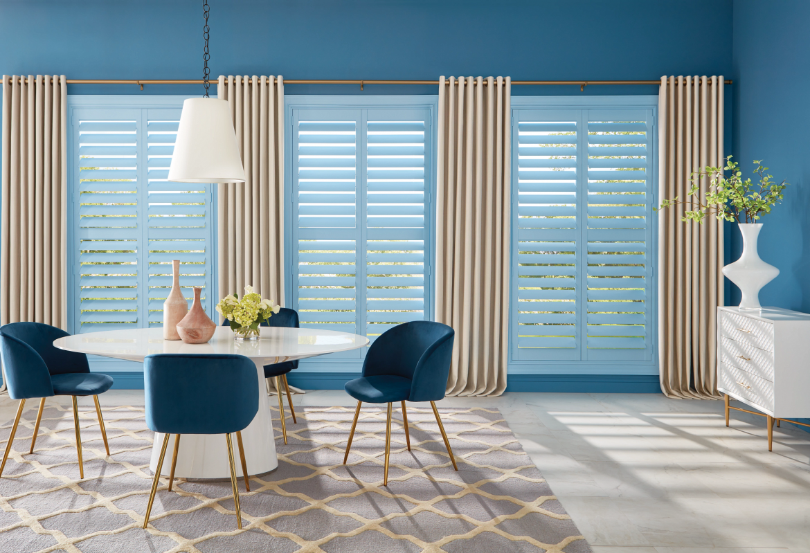 blue and gold dining room with shutters